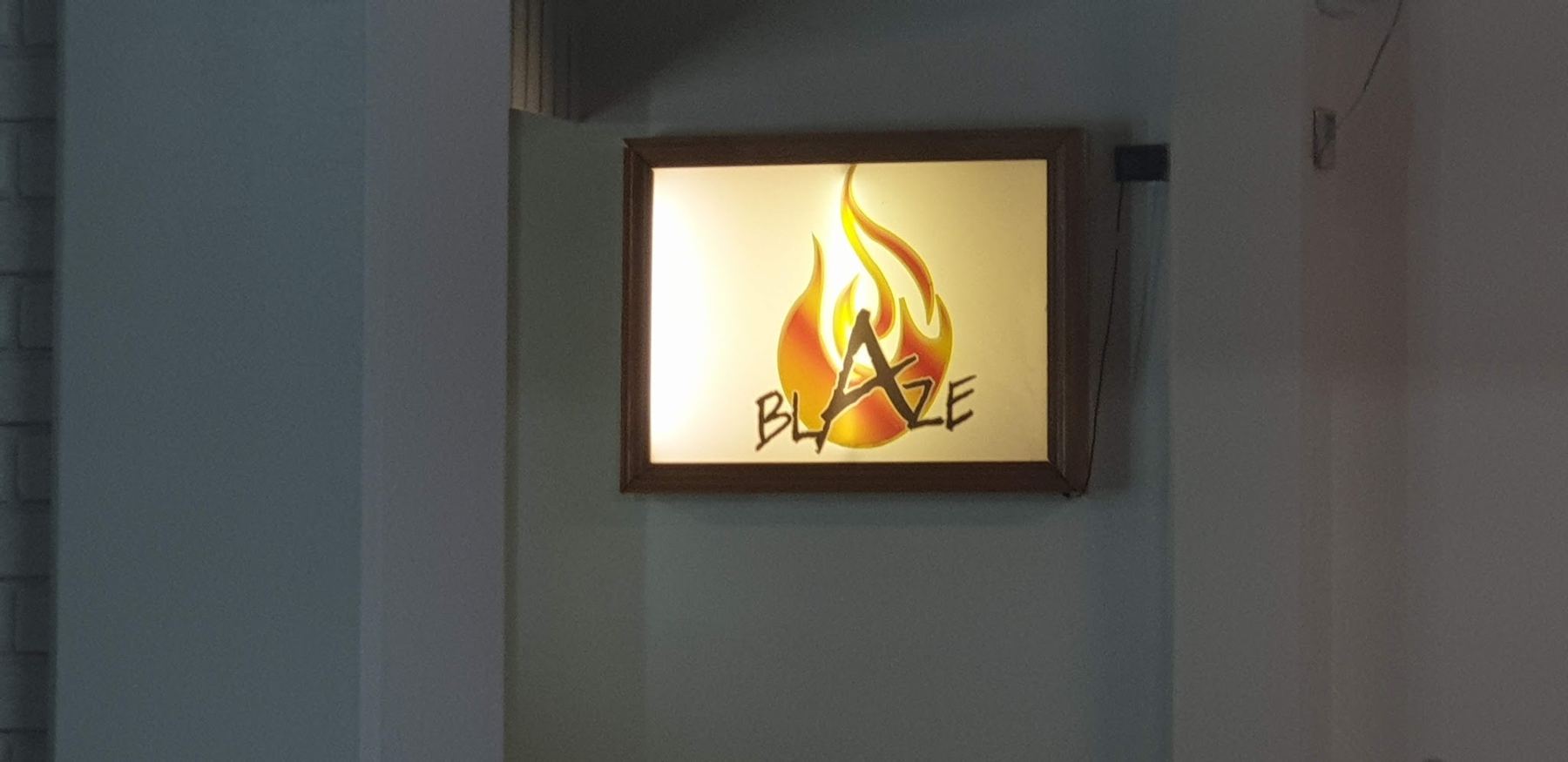 The lit Blaze flame sign